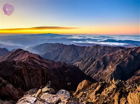Climbers reaching Mount Toubkal summit on a Morocco Adventure Holiday Travel tour